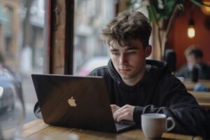 Man on Laptop in Coffe Shop
